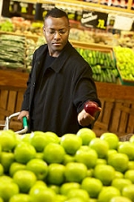 Man picking out fresh apples to buy