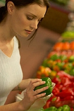 Woman shopping for fresh vegetables